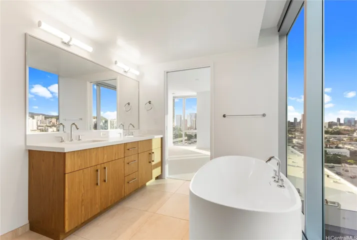 primary bathroom with walk in shower and standing tub