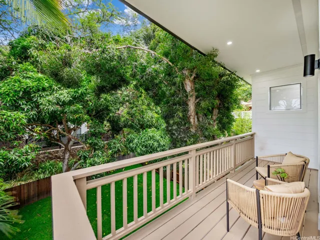Enjoy early mornings or quiet evenings on your private lanai, overlooking a spacious and secluded backyard—an ideal setting for relaxation and connection with nature.