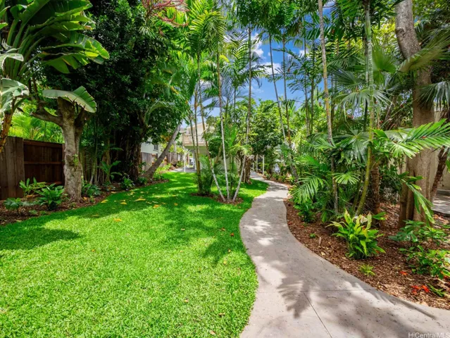 From the main residence, look across the private courtyard toward the street and you’ll barely notice the detached 1-bed, 1-bath loft above the 2-car garage and second laundry room. This thoughtful layout offers exceptional privacy and flexibility—best experienced in person.