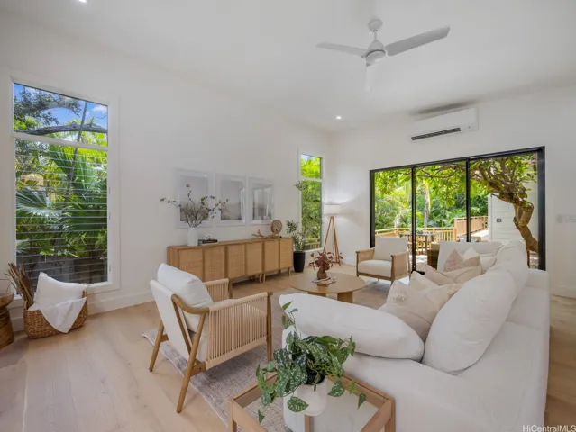 Welcome to your private oasis at 223 Lanipo Drive - where luxury, privacy, and nature converge. Bright and airy living spaces feature hardwood floors, soaring ceilings, skylights and oversized sliding doors that open to one of four lanais. A combination of oversized sliding doors, new 6" jalousie windows plus split AC throughout offers year-round comfort. All furnishings and decor are negotiable for turn-key living from day one.