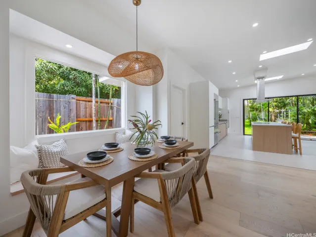 The elegant design offers modern clean lines with added warmth through engineered oak hardwood floors, beautiful fixtures and a glimpse of nature from every angle. Enjoy the dining nook for meals, conversation and entertaining. This large great room provides togetherness but also distinct spaces for everyday living.