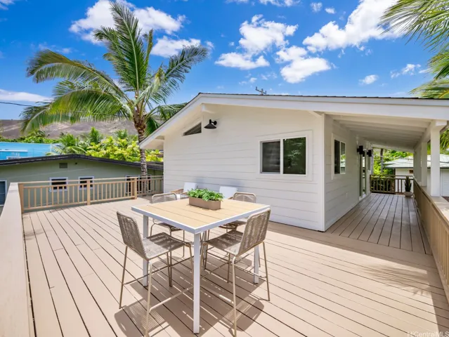 Providing flexibility for multi-generational living, office space, guest quarters or rental income, the street-facing 1-bed, 1-bath suite above the 2-car garage features a spacious private lanai at the rear—perfect for lounging, outdoor dining, or a peaceful morning yoga session surrounded by tropical greenery.