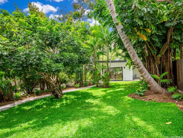 Welcome to your private oasis at 223 Lanipo Drive - where luxury, privacy, and nature converge. A lush, landscaped courtyard creates a serene separation between the detached garage and 1-bed, 1-bath guest suite above and the newly reimagined 3-bed, 3-bath main residence. The courtyard or the large level backyard provide ample space for a pool or water feature to complete this amazing property. This is one of those properties that you must see to fully appreciate the scale, design elements and flexibility this home offers.