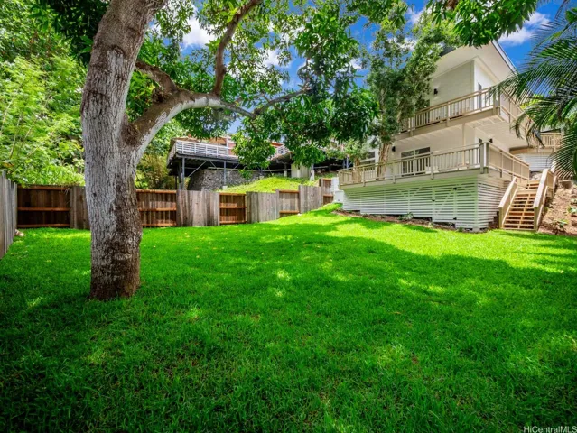 The expansive backyard features a brand-new, beautifully manicured lawn and a mature, fruit-bearing mango tree—offering the perfect setting for play, relaxation, or outdoor entertaining. There is ample space for a large pool!  Please check out the property website or schedule an evening showing to see how beautifully the landscape lighting is at night.