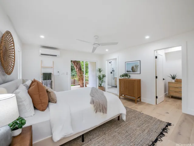 This second primary bedroom offers both a walk-in and a customizable reach-in closet and a walk-in closet, a spa-like ensuite bath, and direct access to a private lanai—creating a perfect blend of comfort, luxury, and functionality. All furnishings and decor are negotiable for turn-key living and convenience.