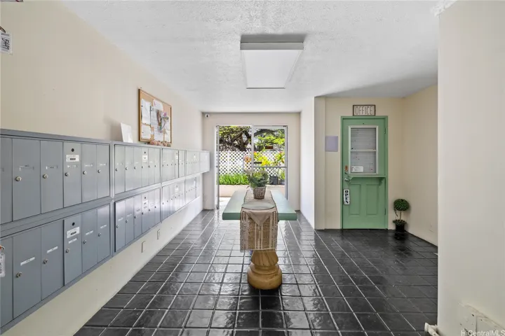 The lobby includes secured mailboxes and access to the resident manager’s office.