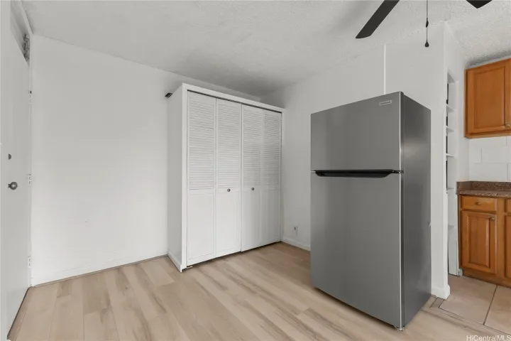 Closet and entry area with new flooring throughout the unit.