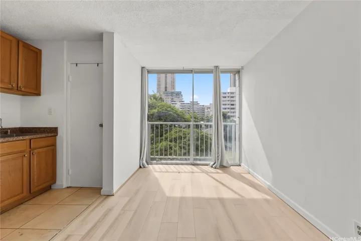 Open living area with natural light. The lanai has been enclosed to provide additional space.