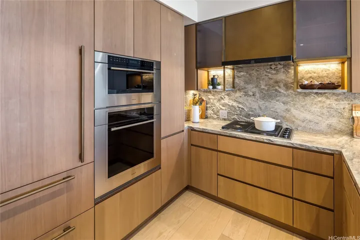 There is plenty of cabinet space and a built-in refrigerator and wine refrigerator.