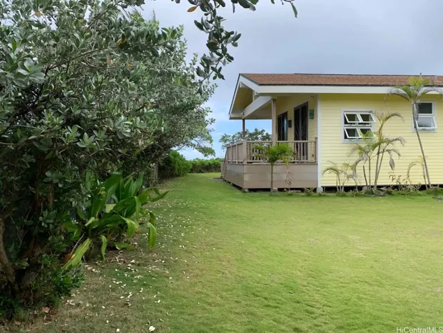 Property has 15 feet wide easement to the sandy beach. There are seasonable ebbs and flows to the shoreline on the neighbor's yellow house shoreline.