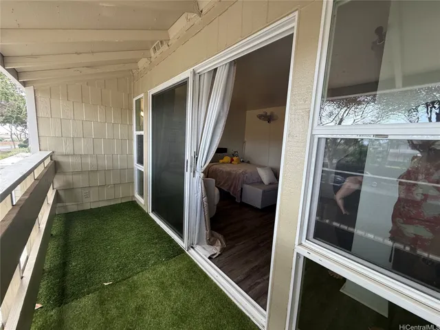 Covered  lanai off the primary bedroom.