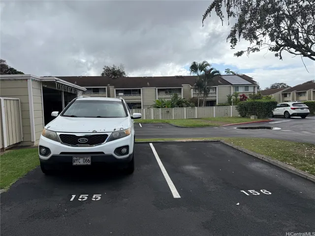 Another parking stall outside the main entrance gate of the house.