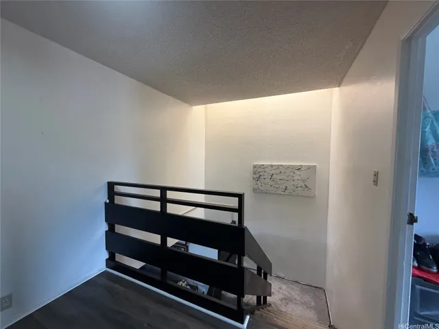 the landing stairs going down to the main area.