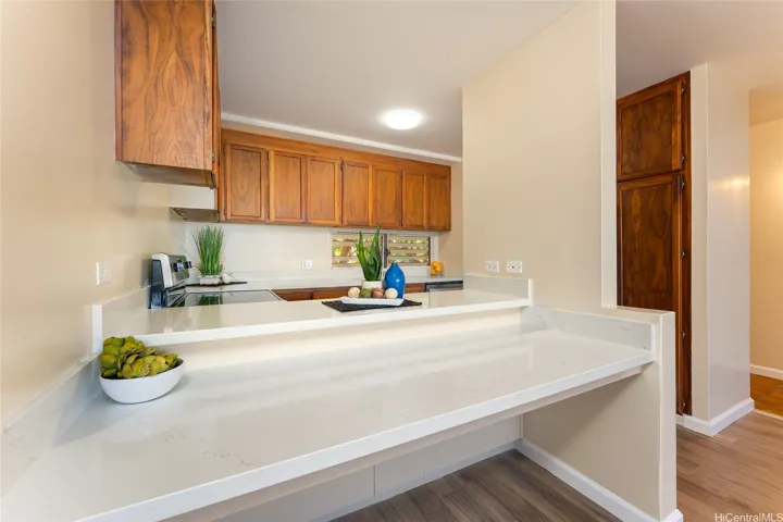 Opened up the kitchen by removing some cabinets and added new counter tops.