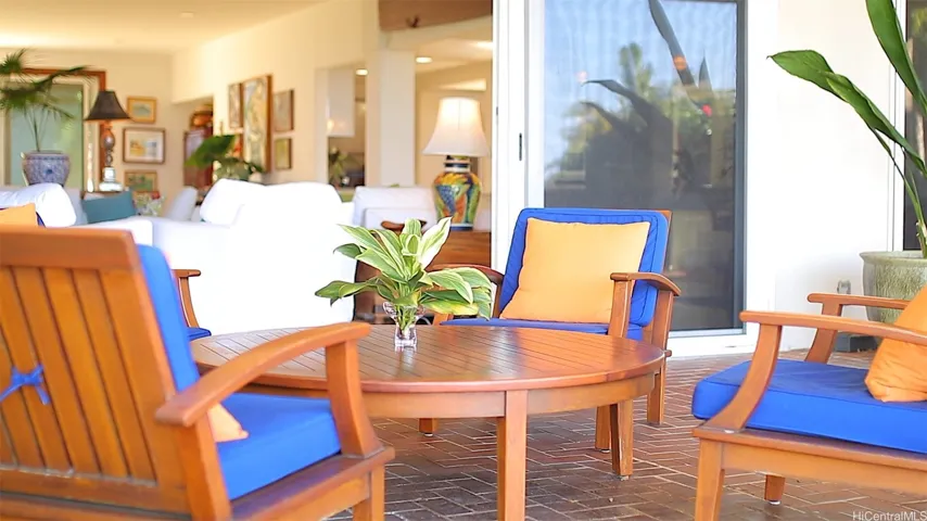 Casual lanai spot for talking story on large lanai with West facing shades down for cool enjoyment.