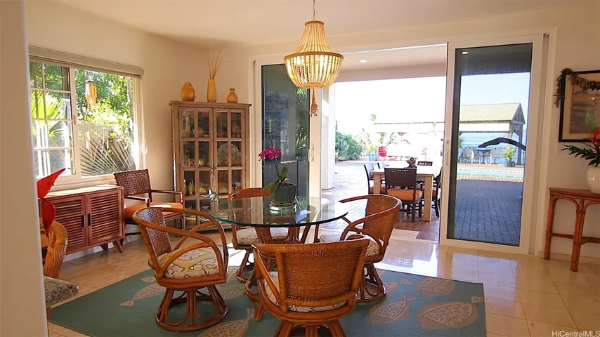 Round glass indoor rattan dining table seats 4 with lanai with mango wood dining table which seats 8.