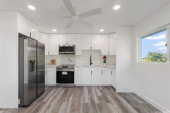 upstairs kitchen with stainless steel appliances.