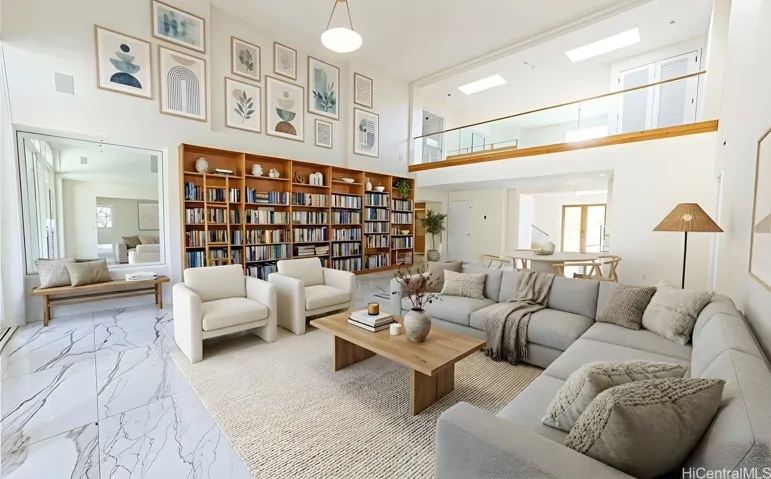 Open living room with built-in bookshelves and porcelain flooring. Enhanced