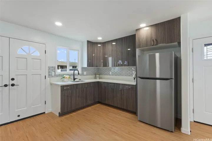 Wet bar downstairs with refrigerator