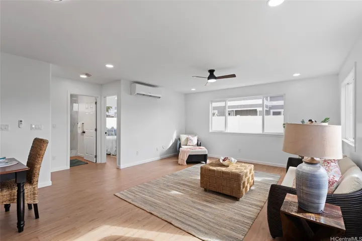 Living room downstairs with view of bedroom and bathroom