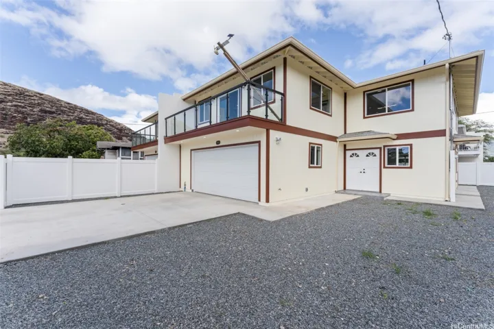 Spacious front entrance showing garage and additional side parking