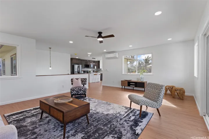 Living room with view of kitchen upstairs