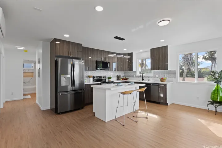 Kitchen with stainless steel appliances upstairs