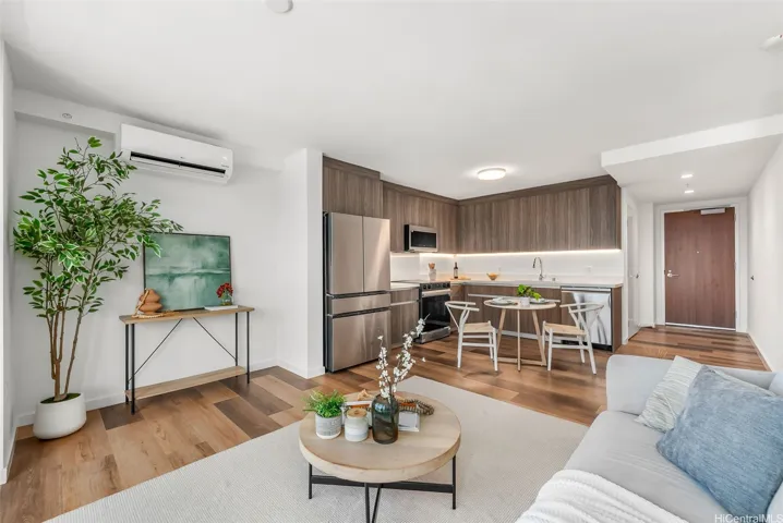 A contemporary kitchen and dining area, highlighting the efficient layout and warm wood finishes