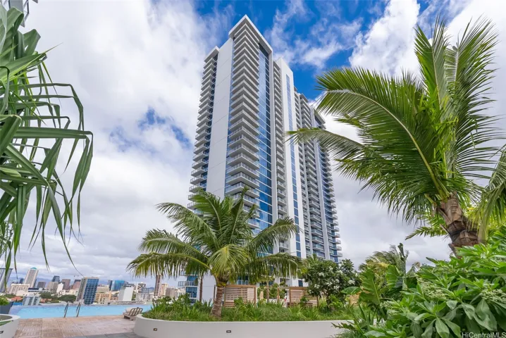 The Liona tower rises above lush tropical landscaping and the resort-style amenity deck.