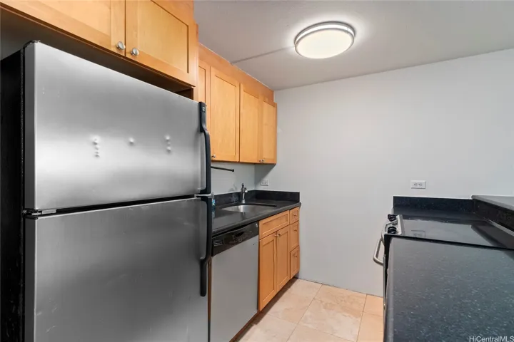 Galley kitchen with dishwasher.