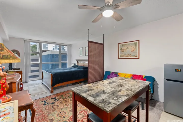 It's large enough to have a sitting/dining area and a bed section.