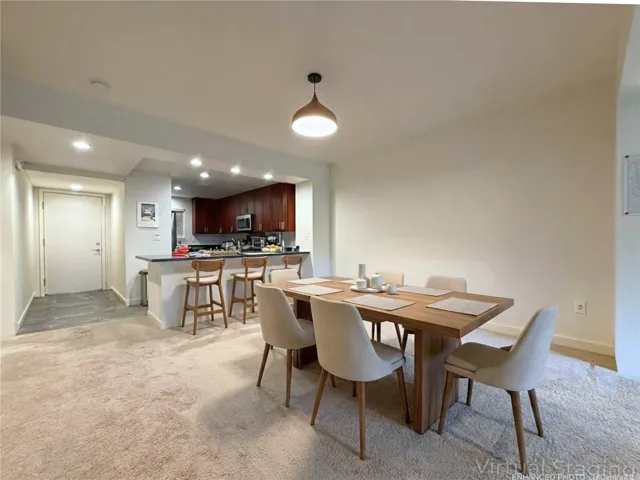 Enhanced & Virtually Staged - Front entry, kitchen, and dining area