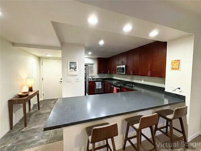 Enhanced & Virtually Staged - front entry and kitchen