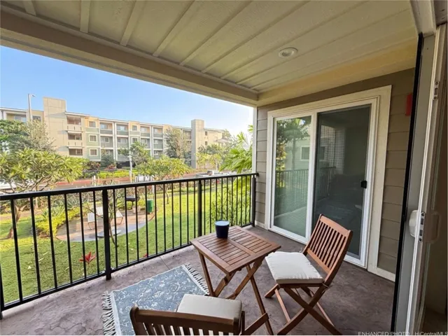 Enhanced - Lanai accessible through living room and primary bedroom. Views of courtyard, Aoloa Street, & Building 6.