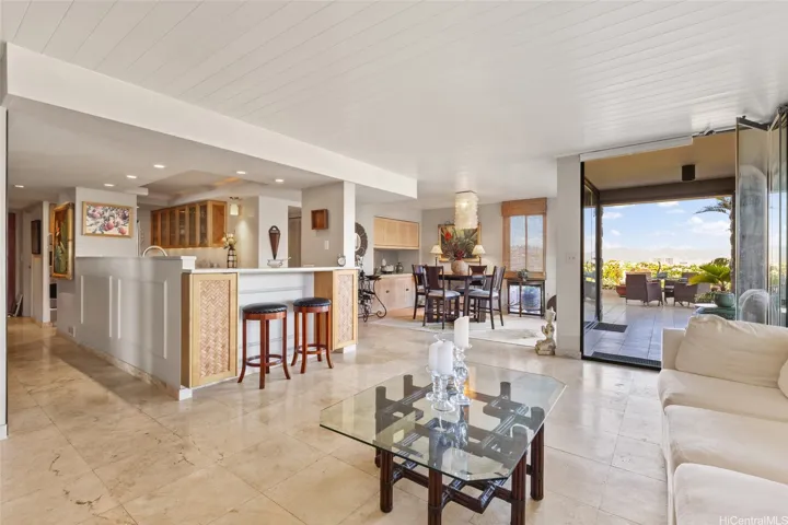 Open living area w/ travertine tile floors