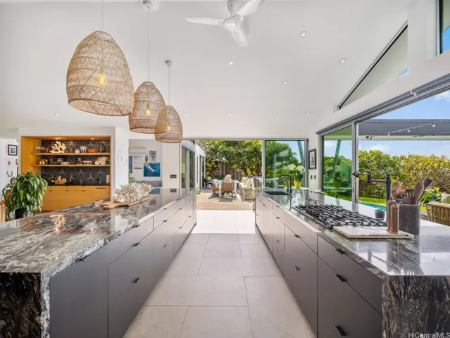 An epicurean kitchen featuring endless cabinet space and beautifully integrated hidden features.