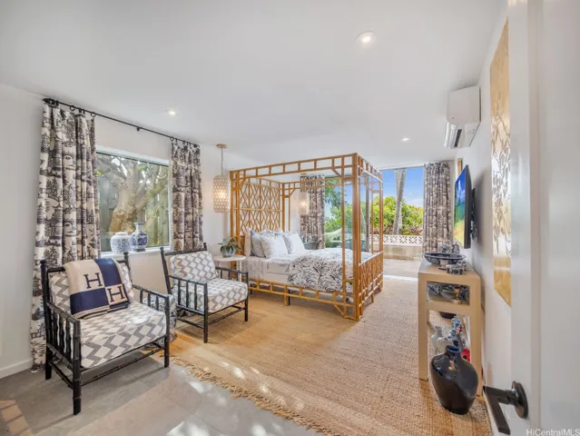 An exquisitely elegant ensuite with direct access to the backyard oasis.