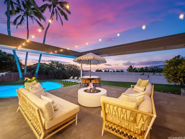 The kitchen flows seamlessly to the outside deck area creating an inviting ambiance while taking in the views.