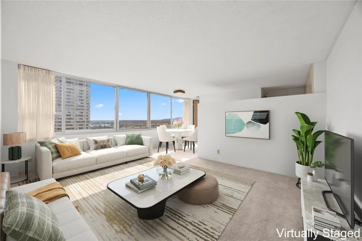 Welcome to Century Park Plaza! This 19th floor corner unit offers stunning mountain and ocean views. This photo is virtually enhanced to showcase the potential layout of the living and dining space.
