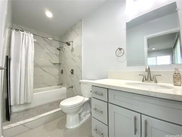 Primary bathroom offers space for both a walk-in shower and a bathtub.
