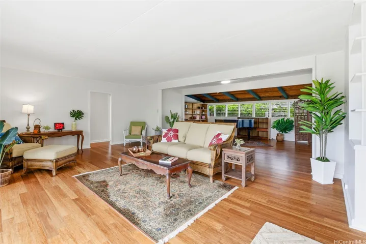 The living room looking towards the extended area and the back of the home.