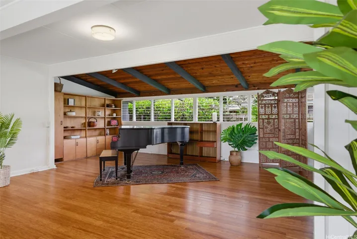 Living room flows into an extended area -allowing for many different options.