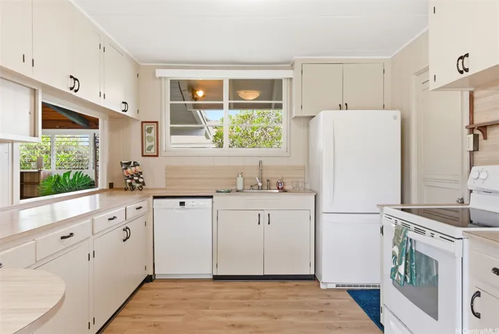 Enter from the carport into the kitchen - lots of opportunity to re-imagine this space.  Just ask me my ideas at the open house! Or simply love it as is!