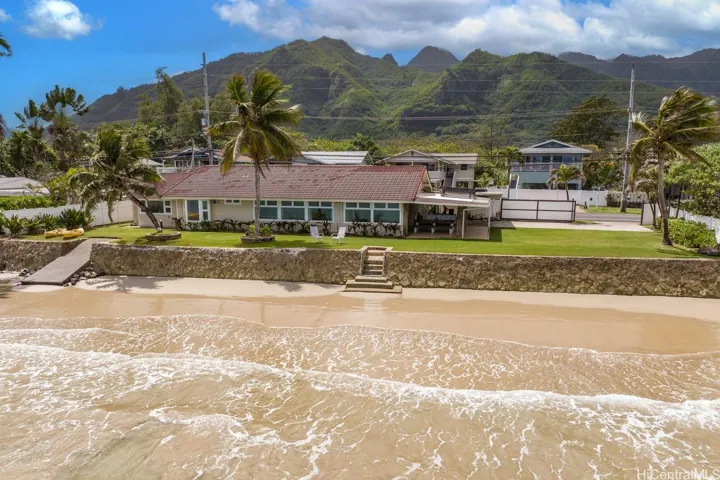 Fabulous beachfront property with 140' long beachside boundary. Longer than most beachfront properties. Steps away from the sandy beach. Even comes with a small boat ramp!