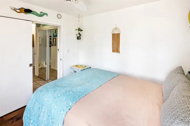 Cozy second bedroom with a relaxing vibe, shown looking back toward the hallway and generous closet for easy everyday living.