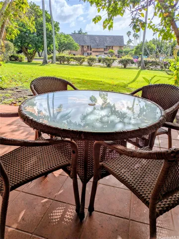 Back patio fronting lush grassy area