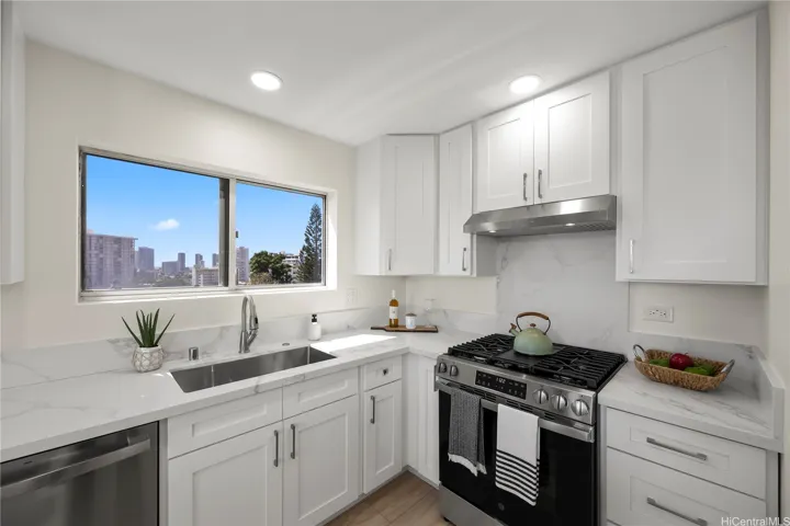 Remodeled kitchen with quartz counter tops, hardwood cabinetry, new appliances and recessed lighting