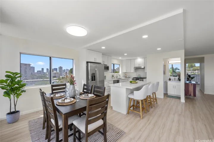 Dining area and remodeled kitchen in the background