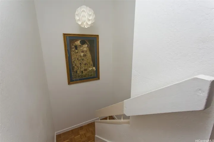 Stairwell to second floor bedrooms and full baths