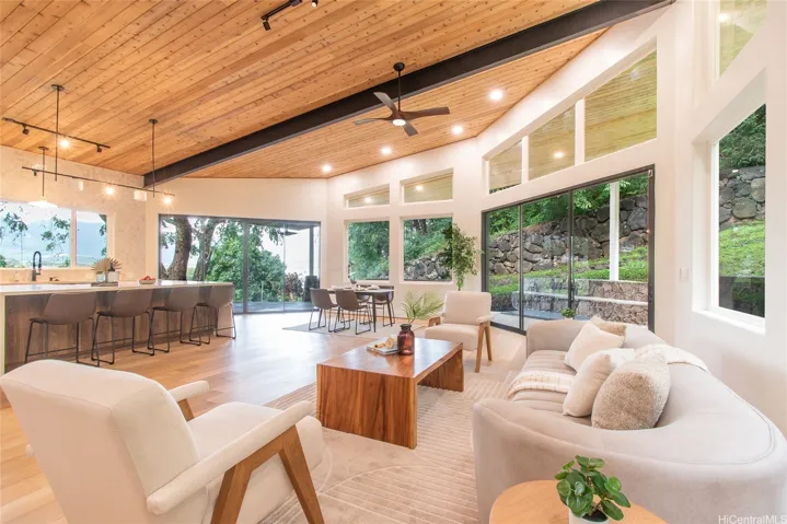 Vaulted cedar lined ceilings transition beautifully inside and outside the home